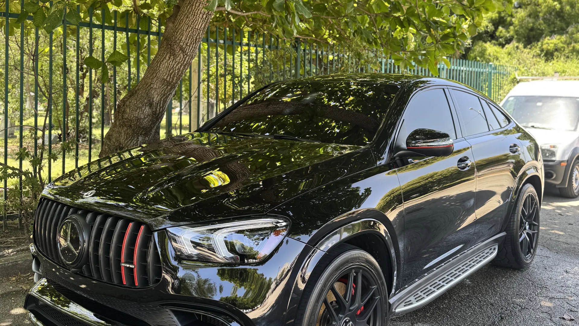 Freshly detailed black Mercedes-AMG GLE 63 S coupe in a Miami driveway